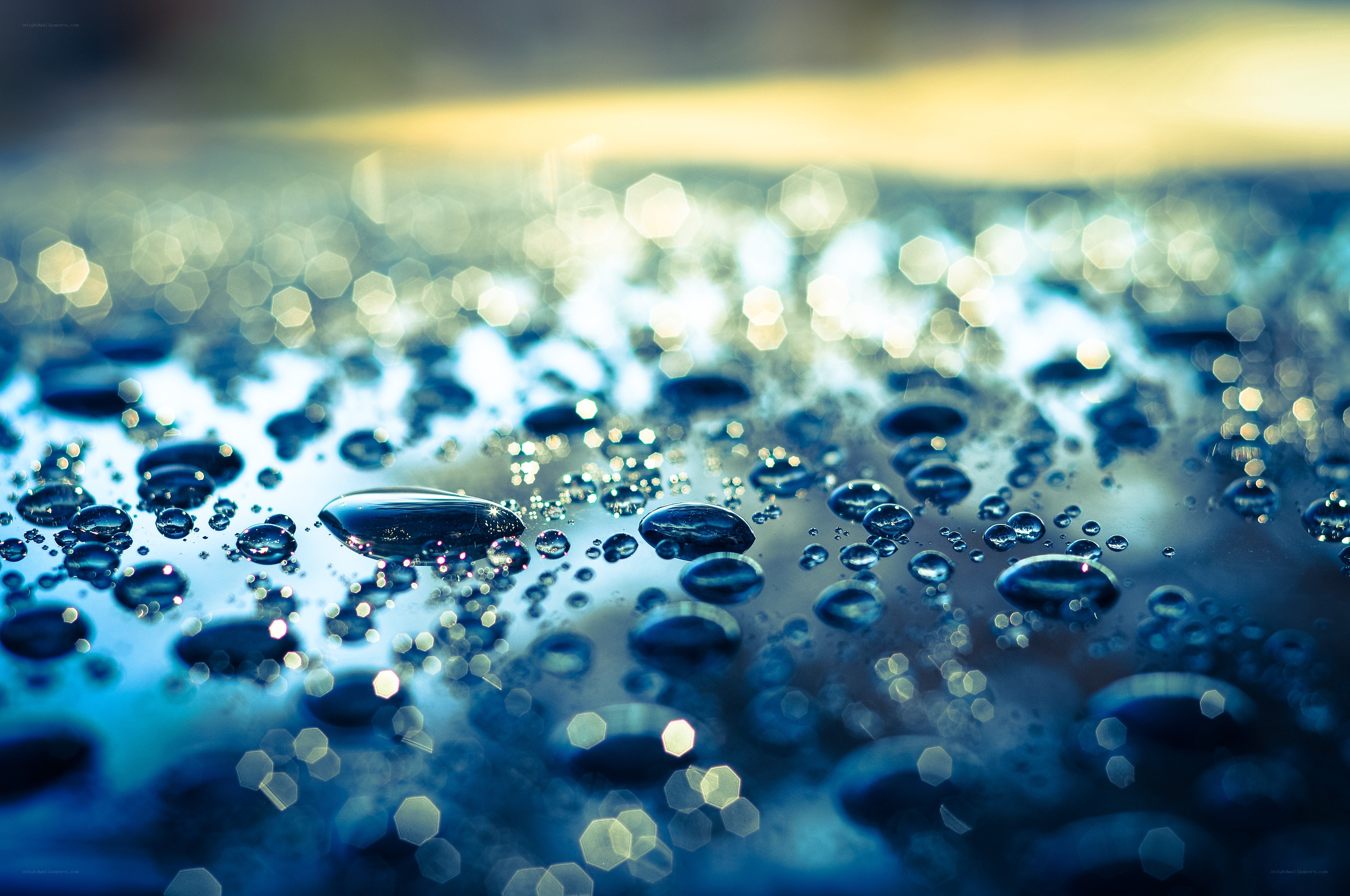 Water droplets on a reflective surface