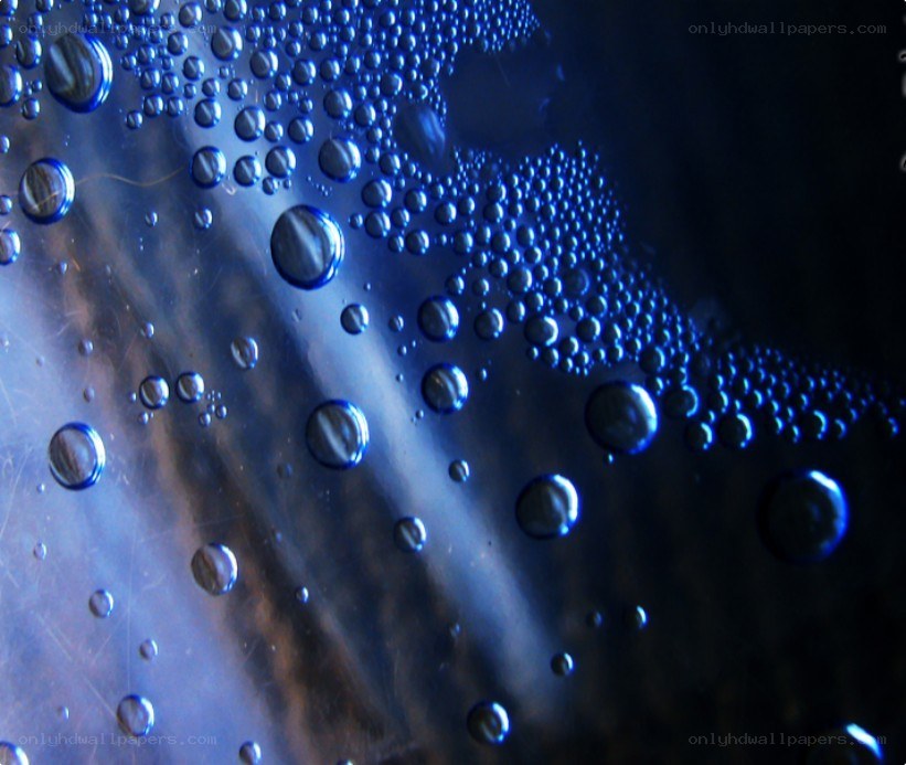Water droplets on a reflective surface