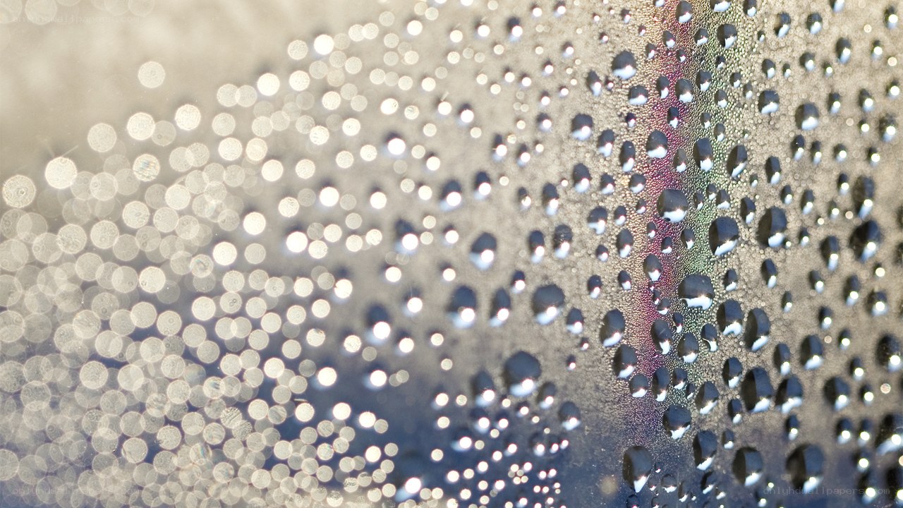 Water droplets on a reflective surface