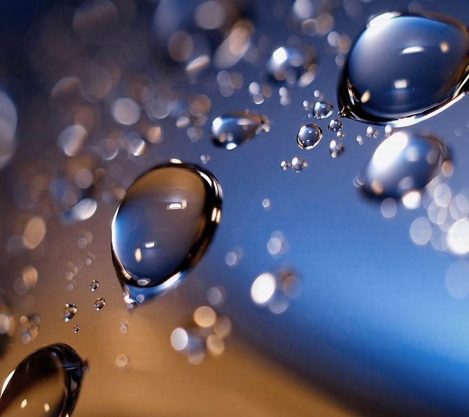 Water droplets on a reflective surface