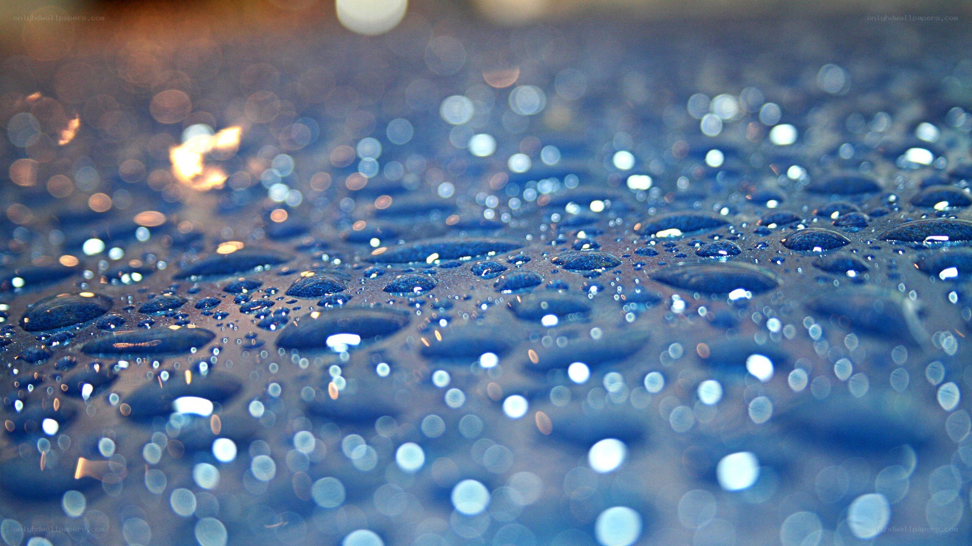 Water droplets on a reflective surface