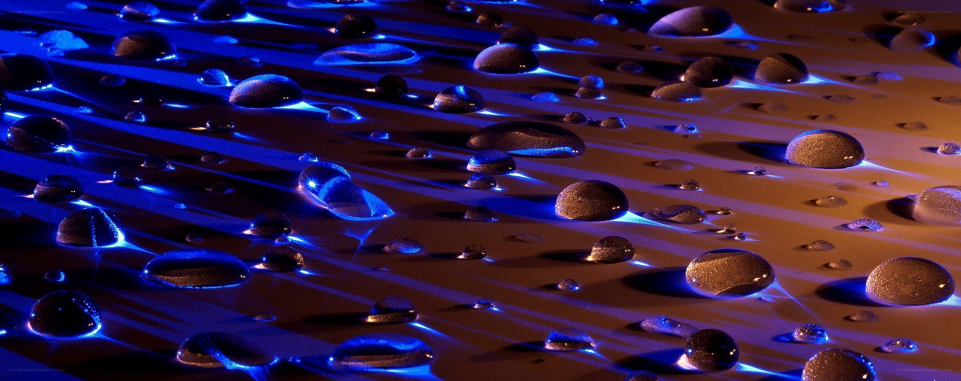 Water droplets on a reflective surface