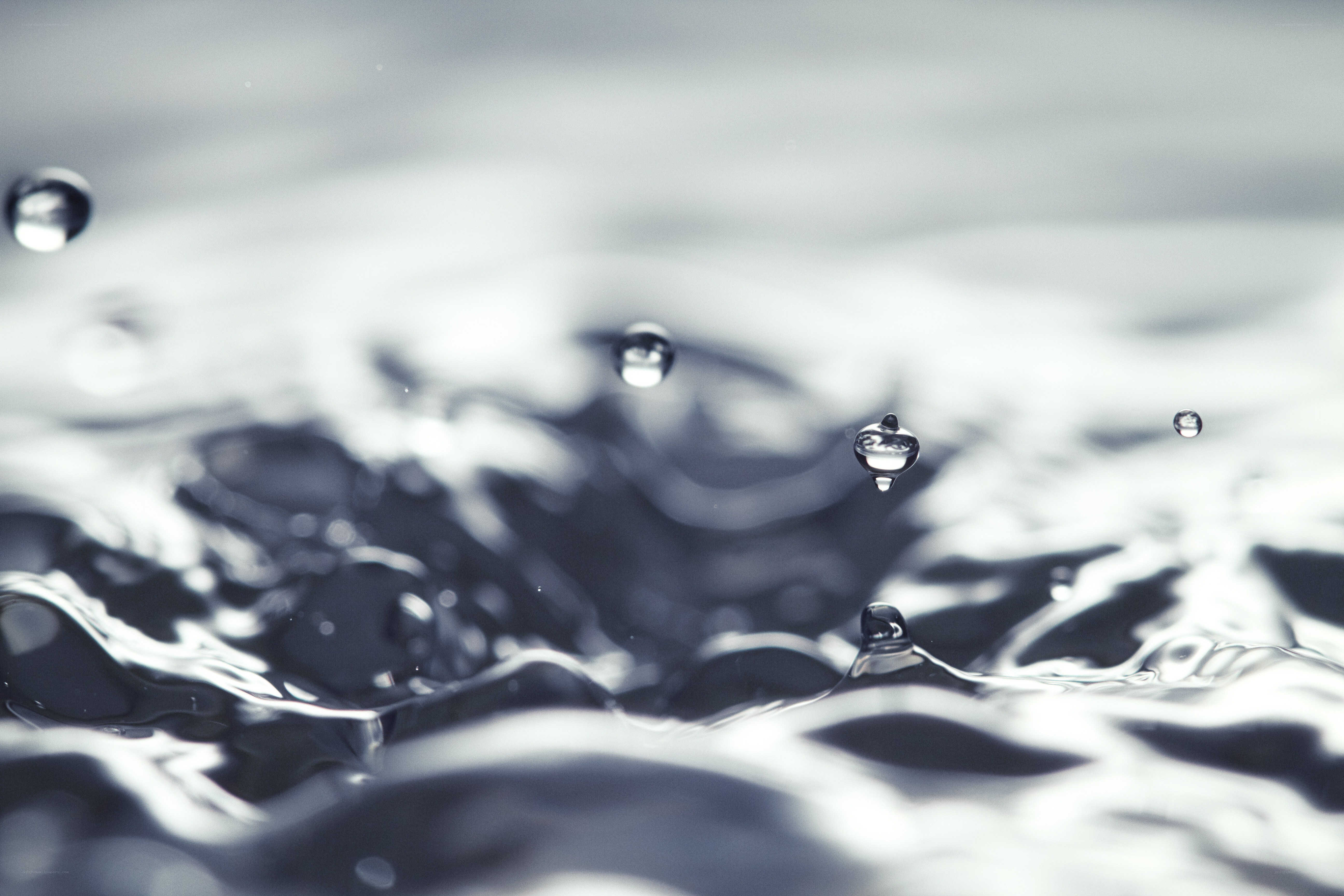 Water droplets on a rippling surface