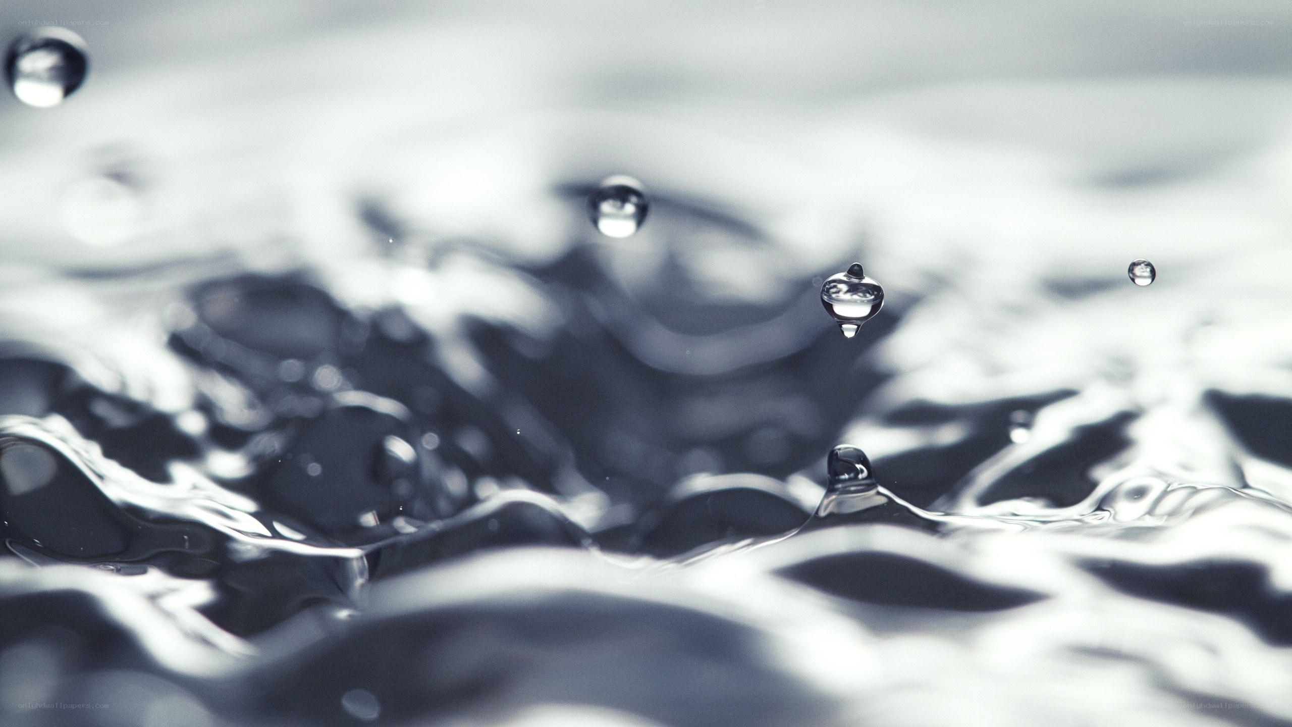 Water droplets on a rippling surface
