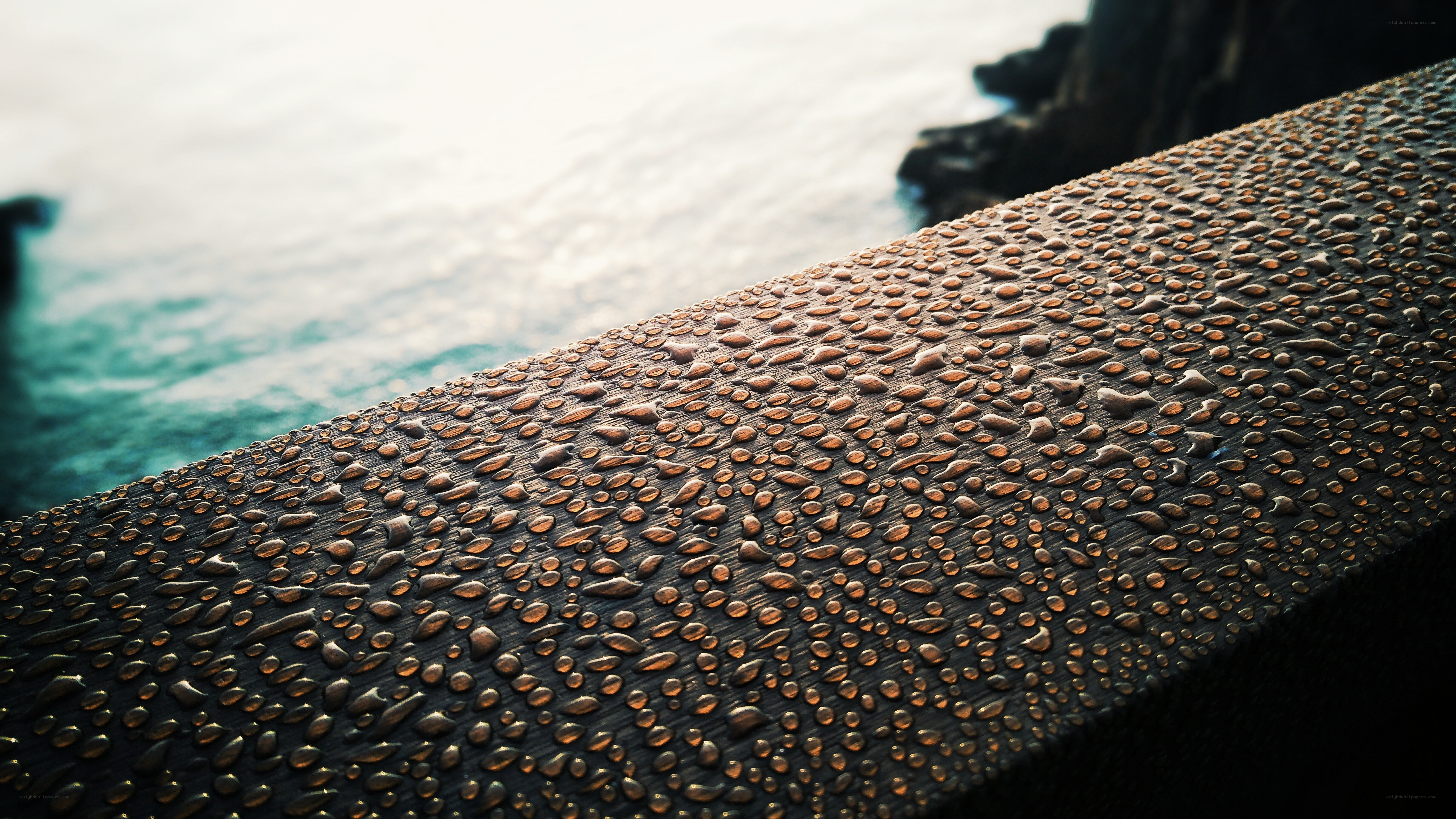 Water droplets on a wooden surface