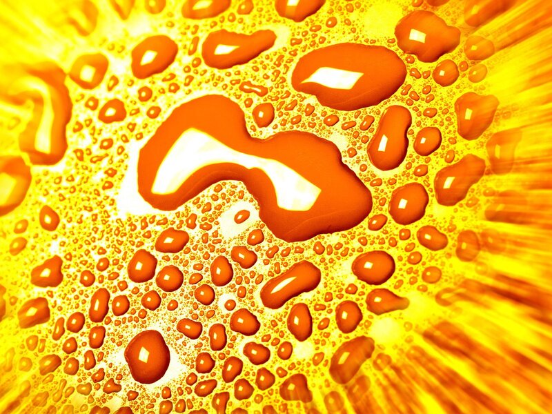 Water droplets on a yellow surface