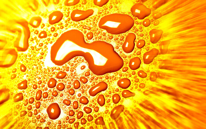 Water droplets on a yellow surface