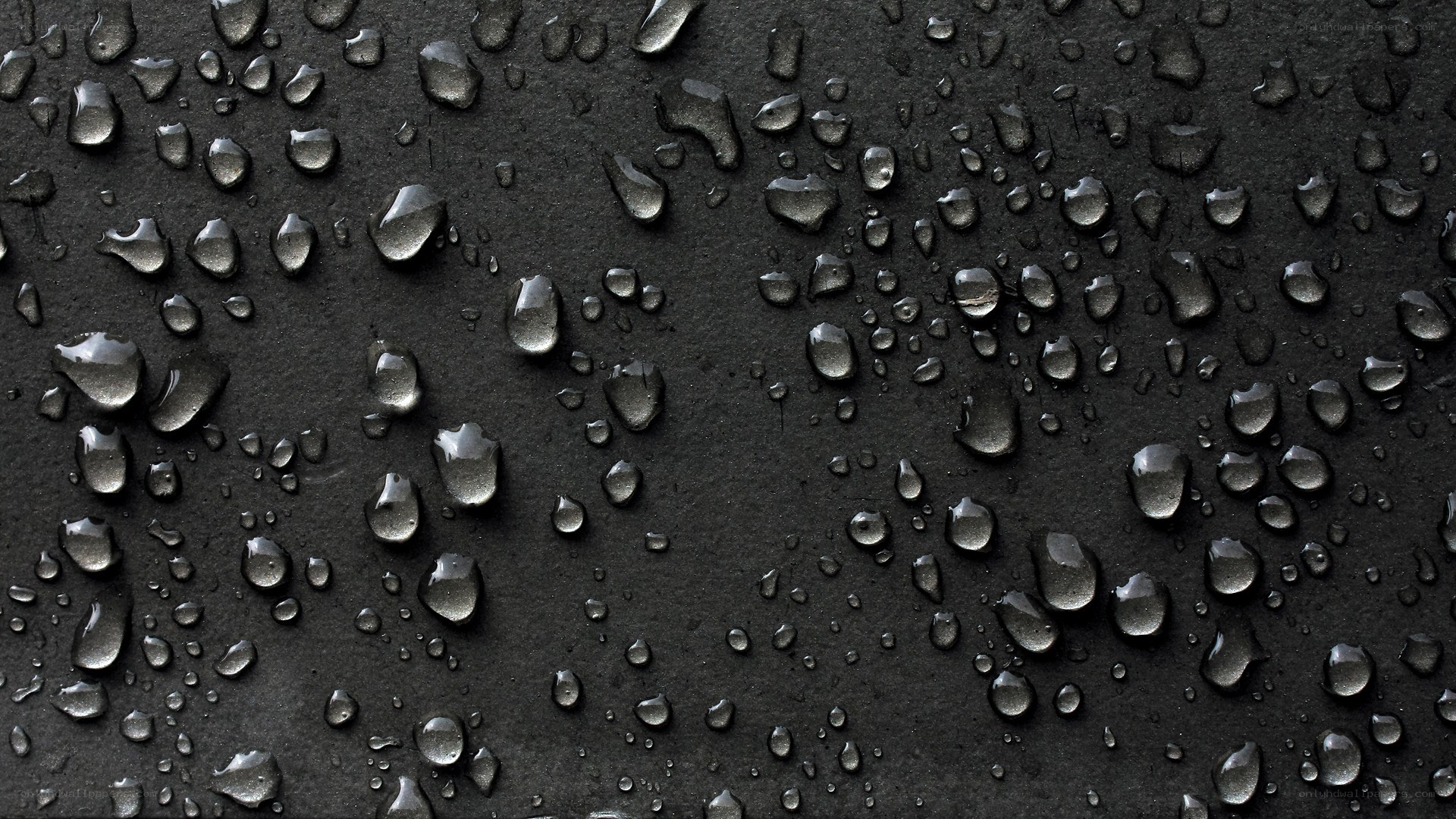 Water droplets on black surface