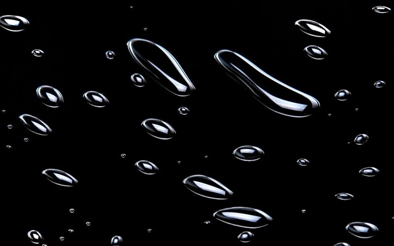 Water droplets on black surface