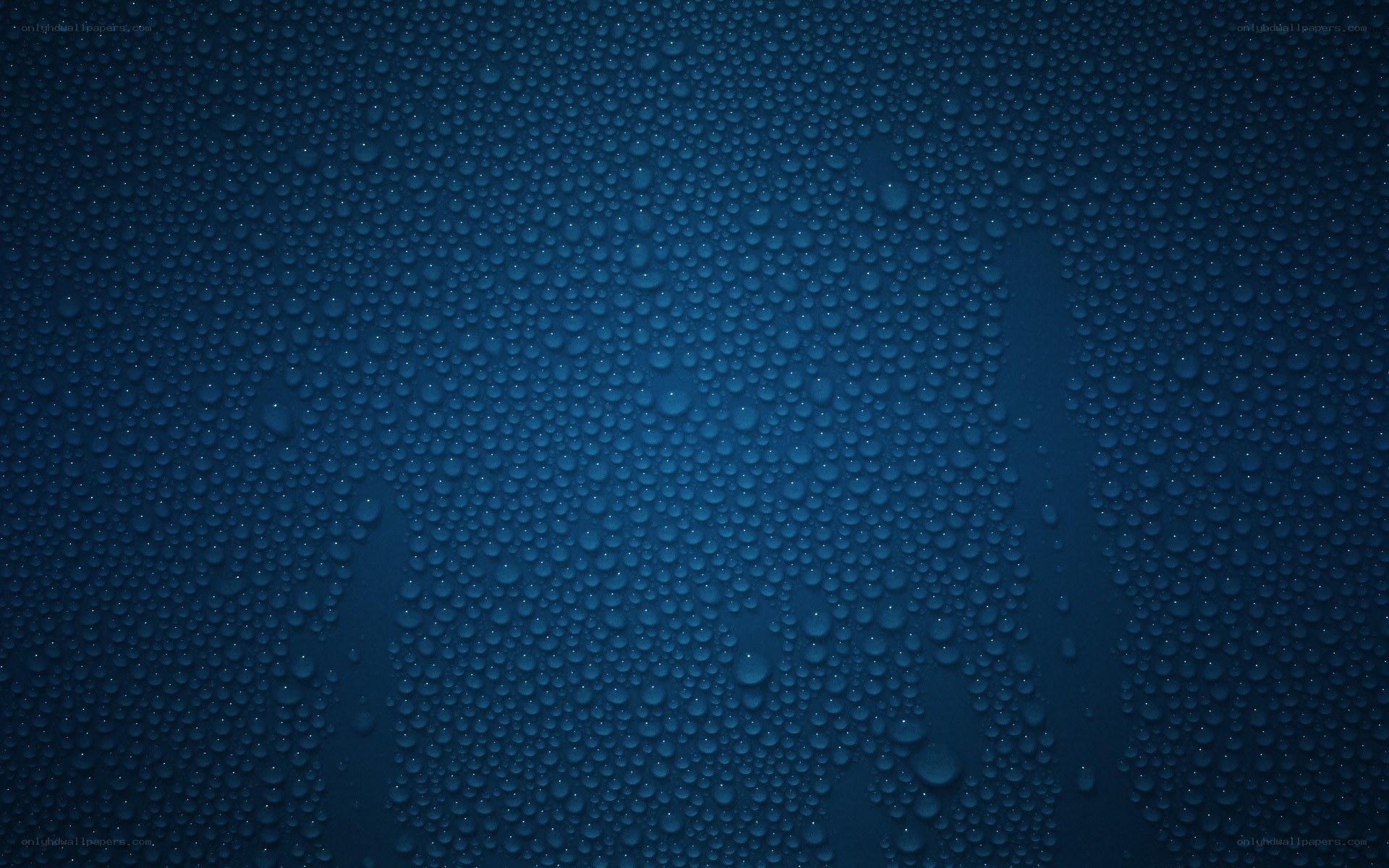 water droplets on blue surface