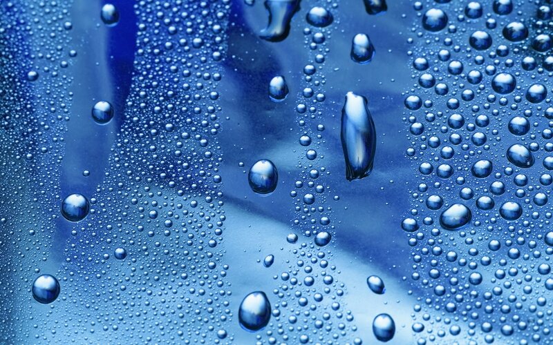 Water droplets on blue surface