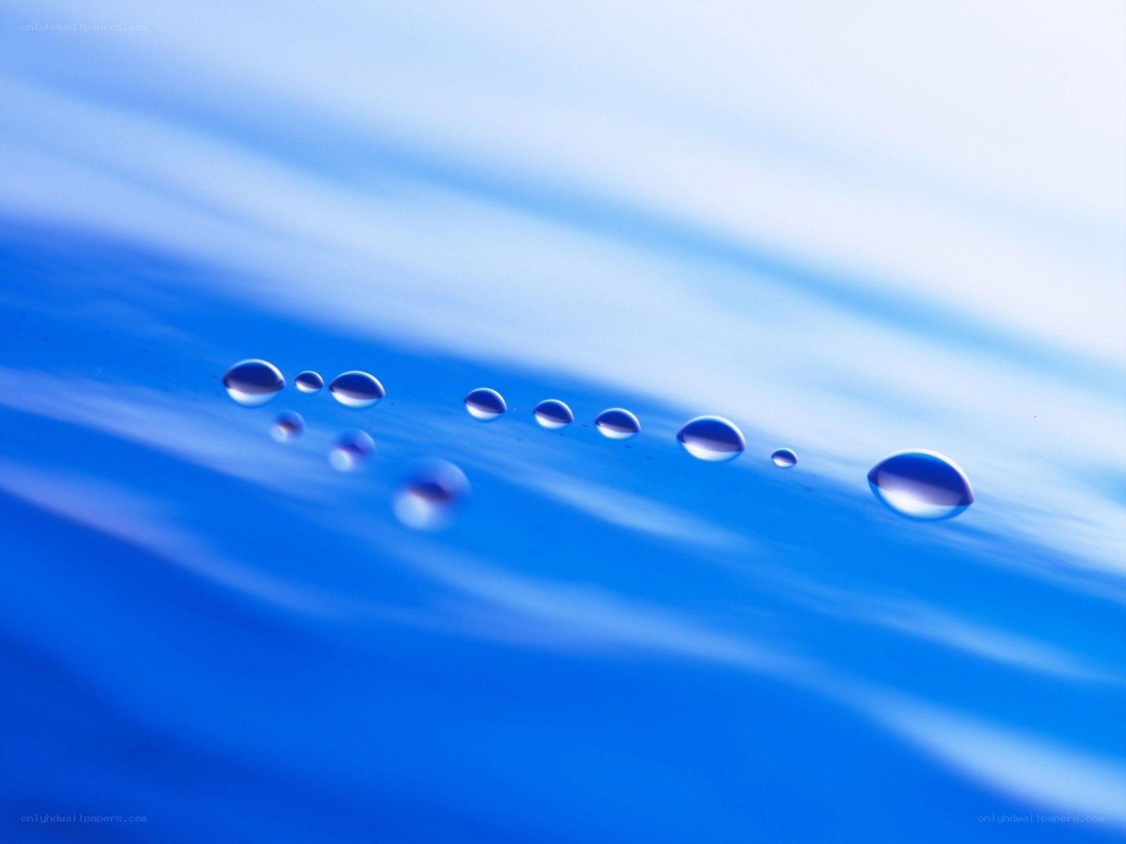 Water droplets on blue surface