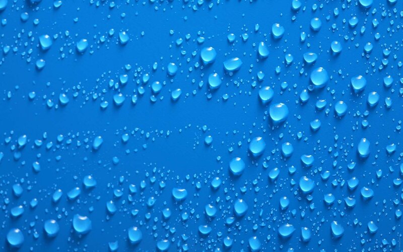 Water droplets on blue surface
