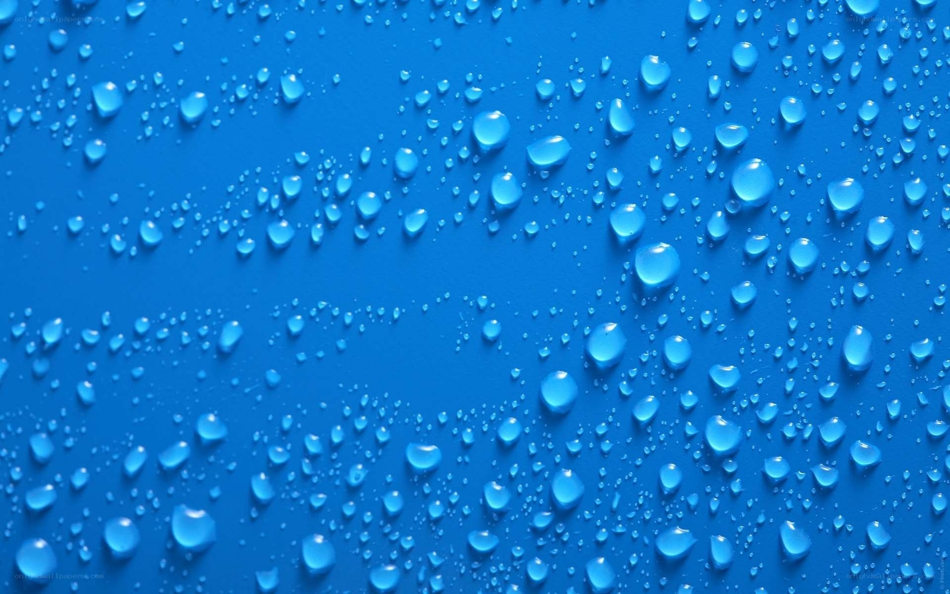 Water droplets on blue surface
