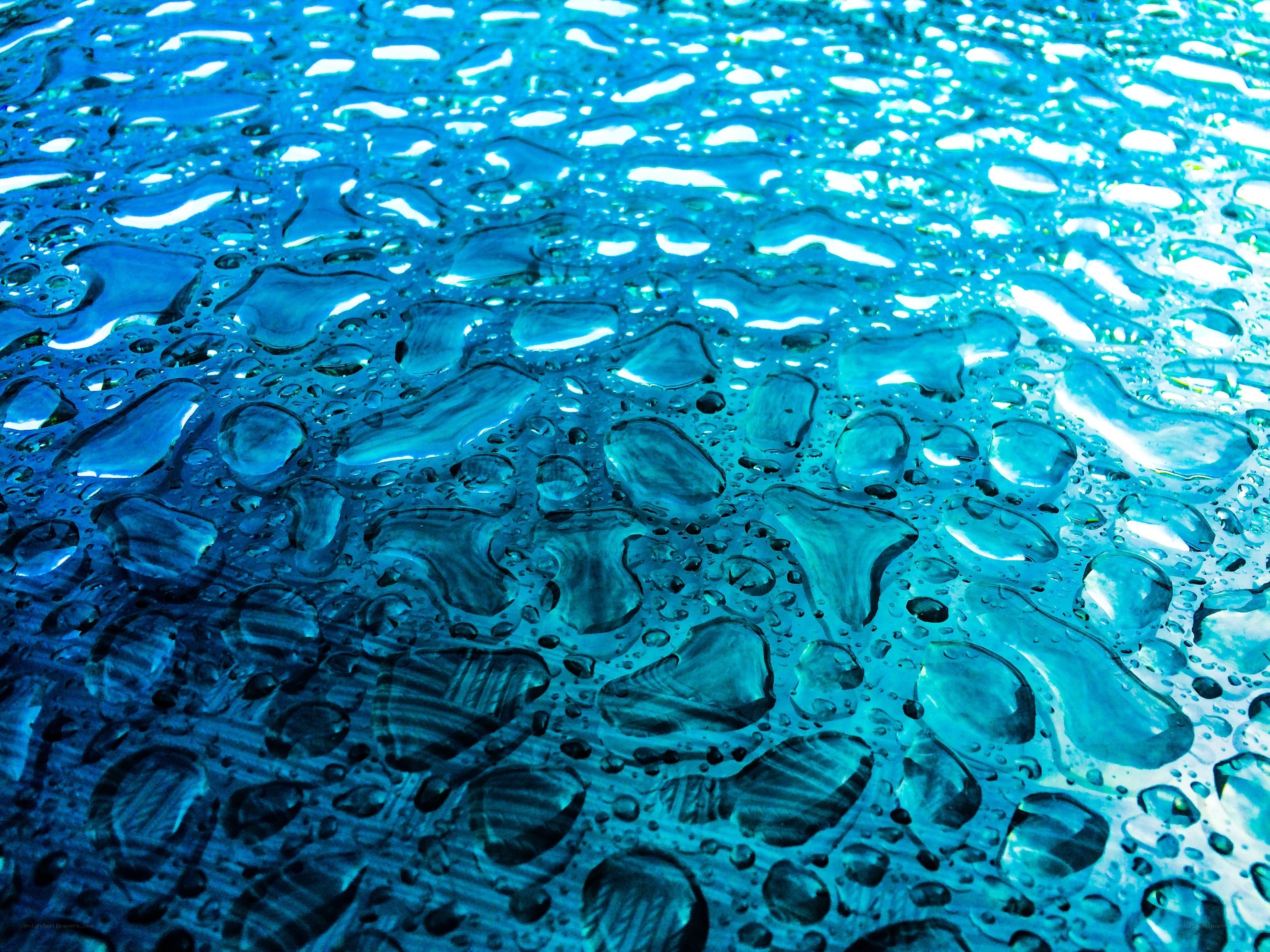 Water droplets on blue surface