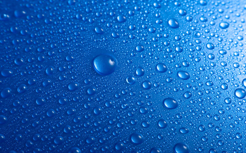 Water droplets on blue surface