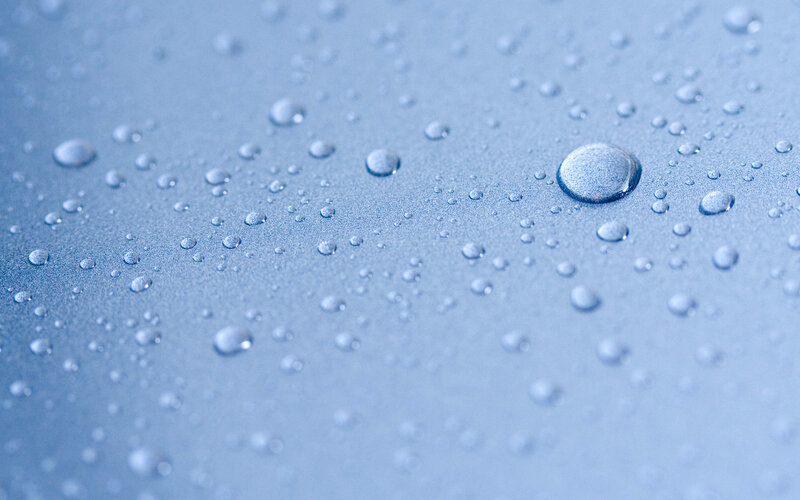 Water droplets on blue surface