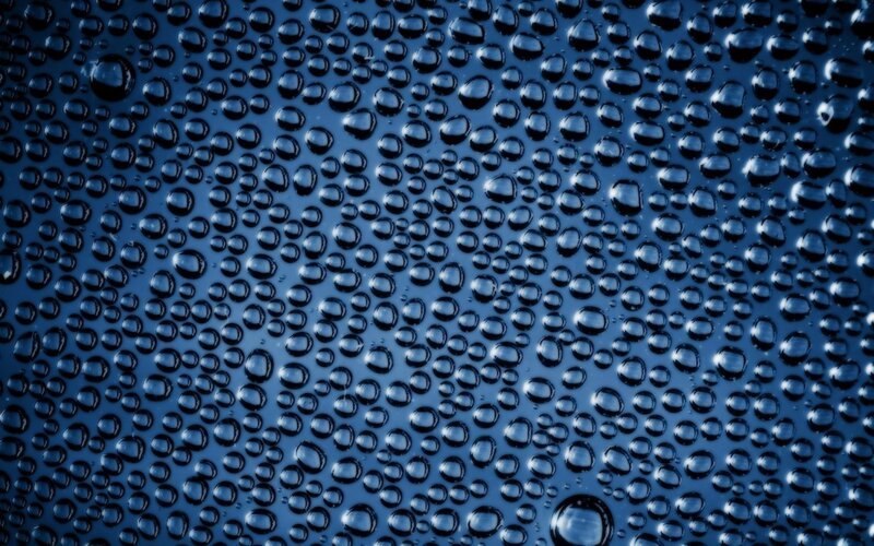 Water droplets on blue surface