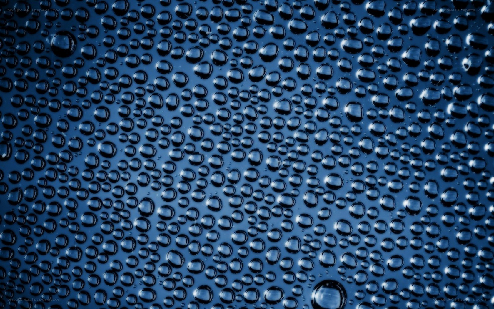 Water droplets on blue surface