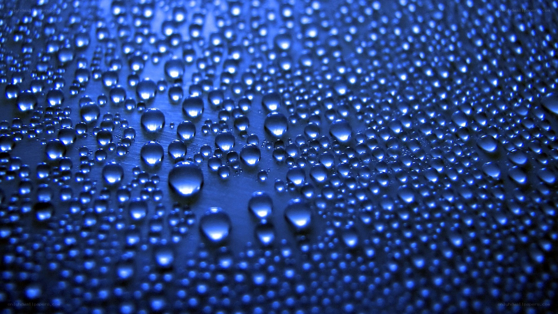 Water droplets on blue surface