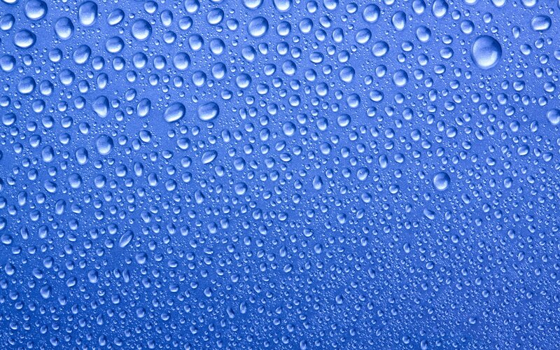 Water droplets on blue surface