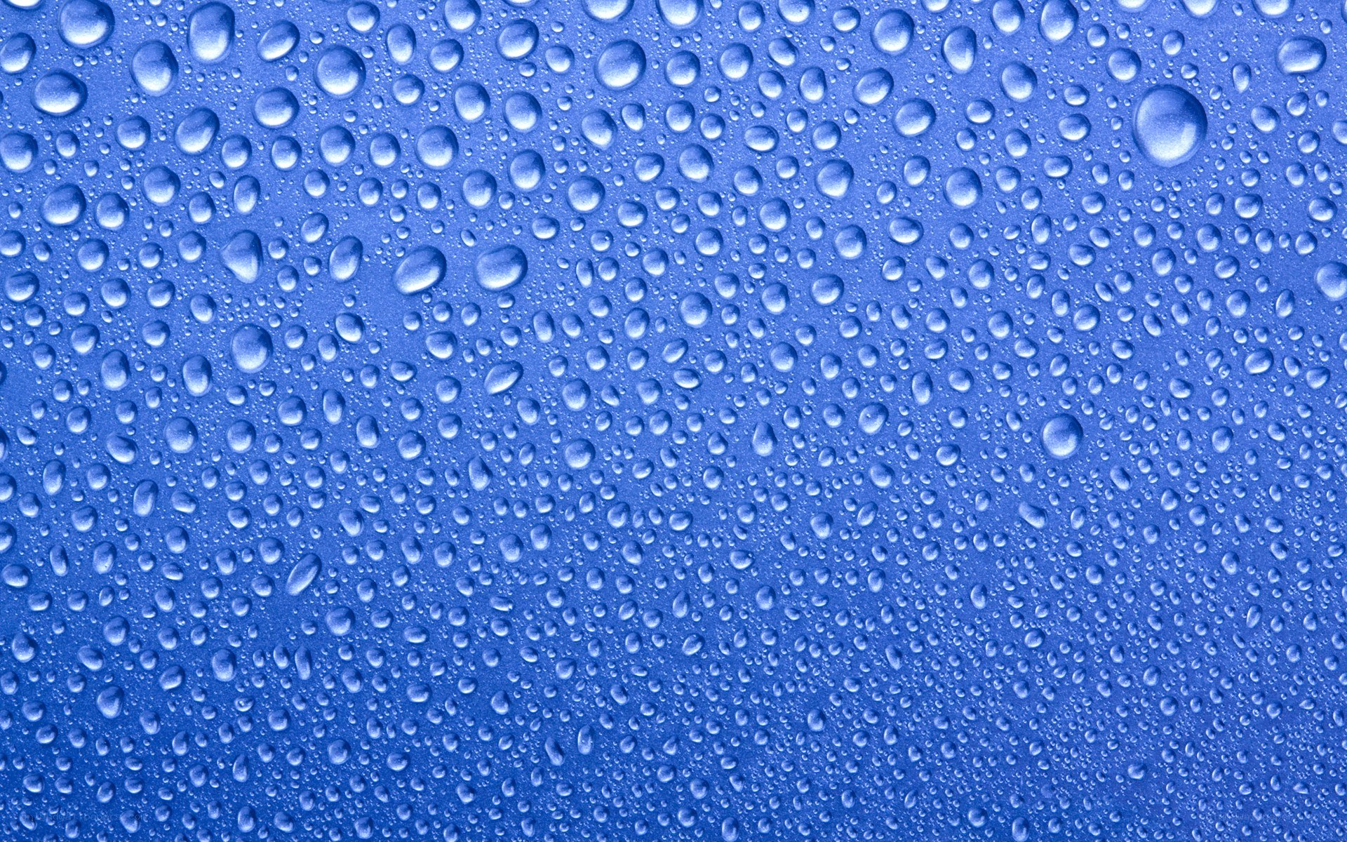 Water droplets on blue surface