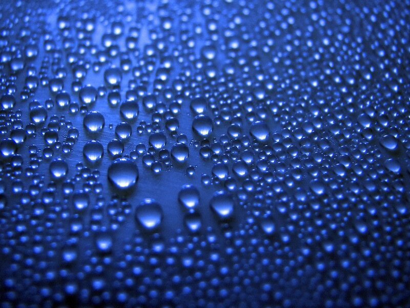 Water droplets on blue surface