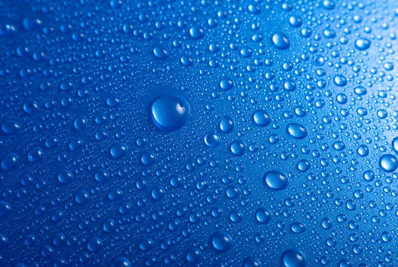 Water droplets on blue surface