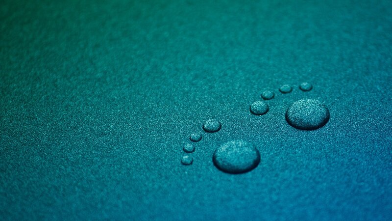 Water droplets on blue surface