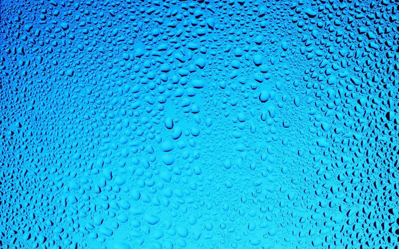 Water droplets on blue surface