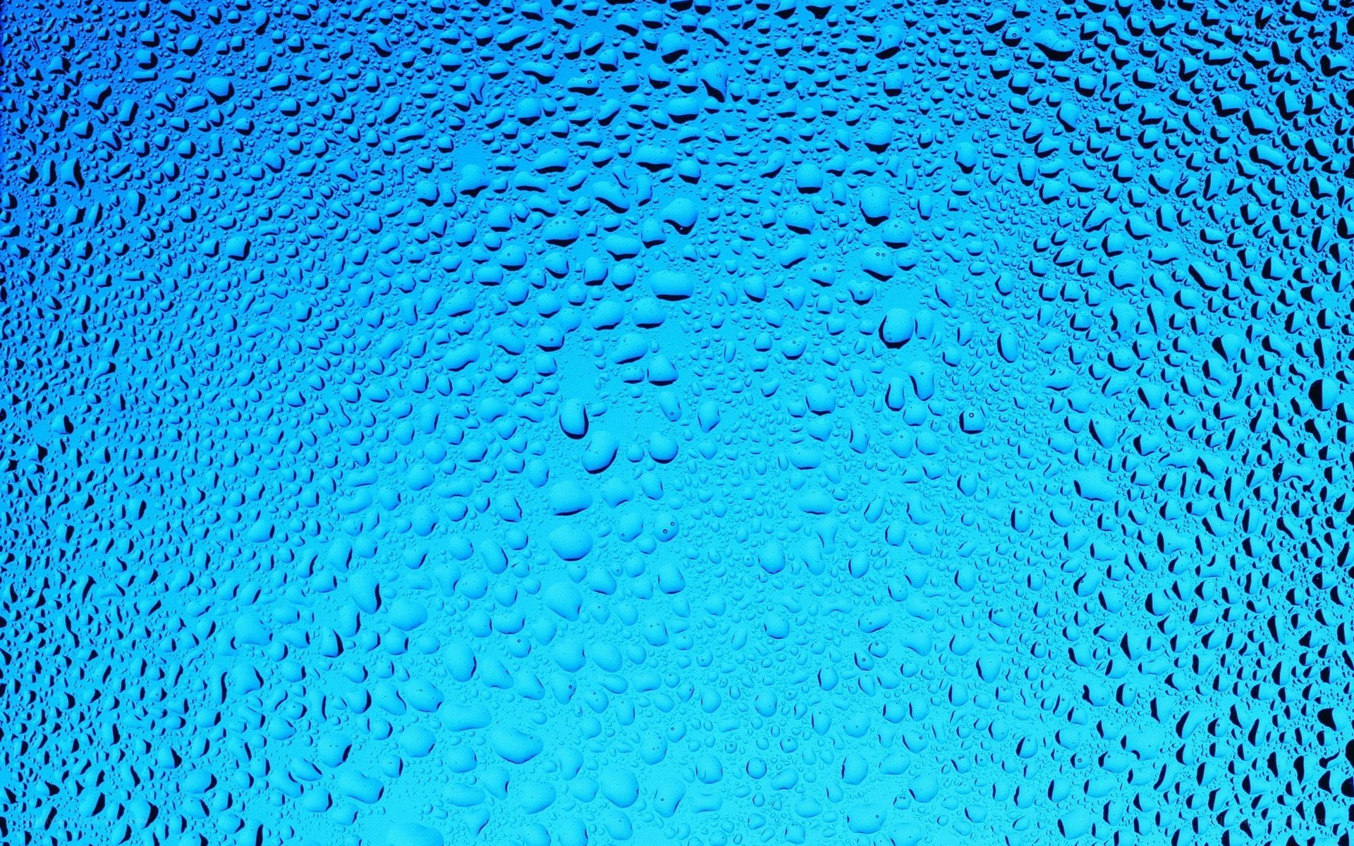 Water droplets on blue surface