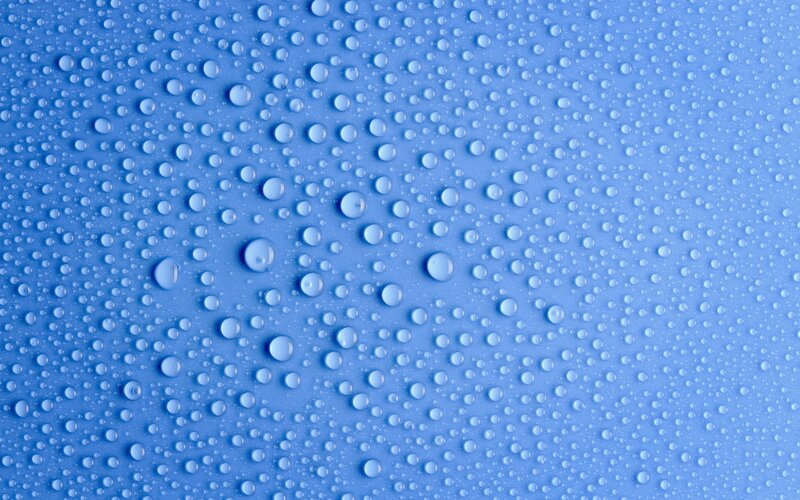 Water droplets on blue surface