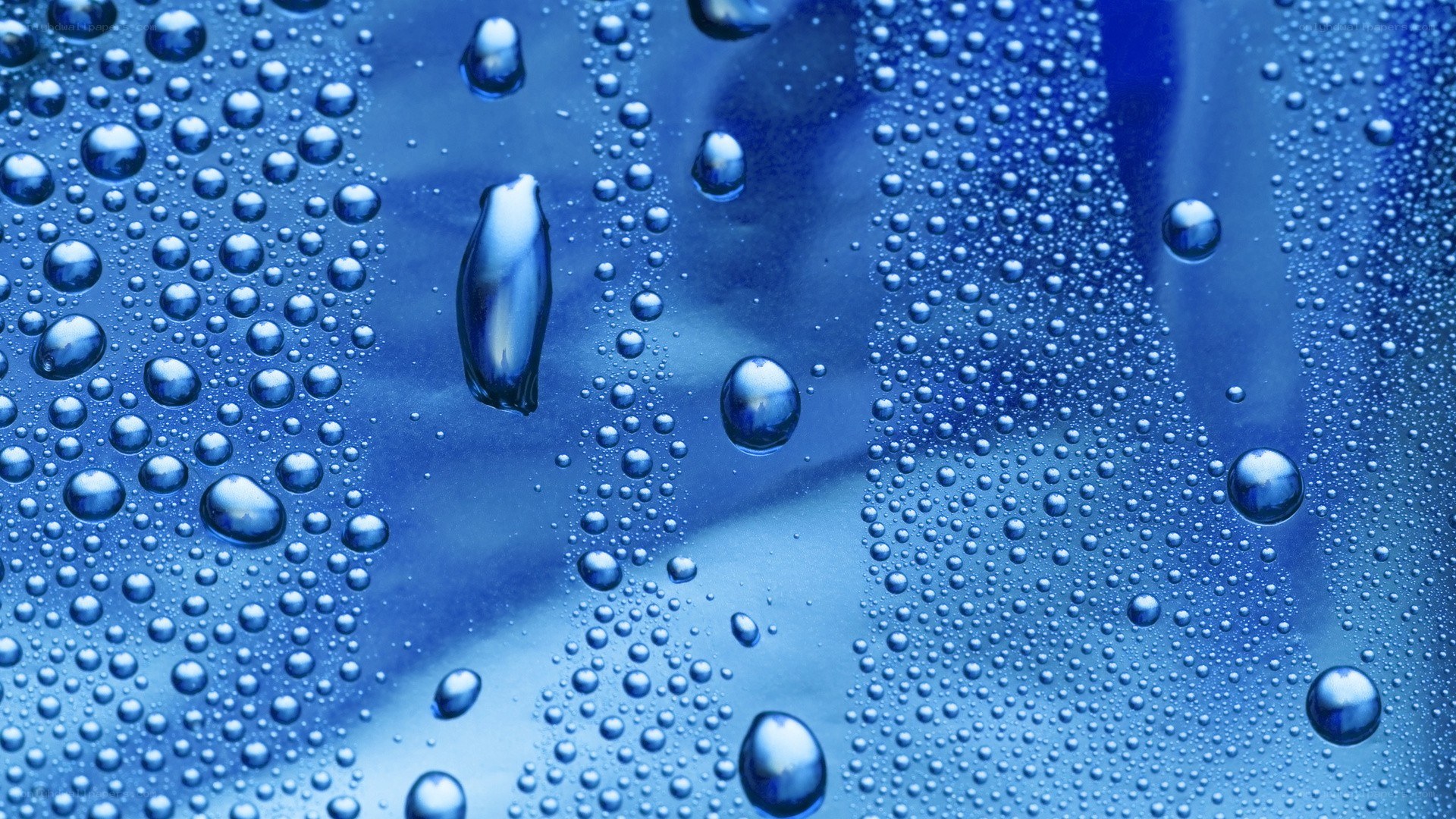 Water droplets on blue surface