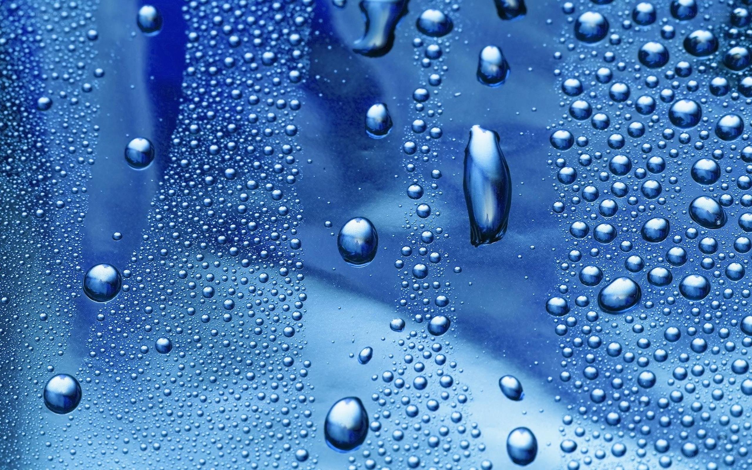 Water droplets on blue surface