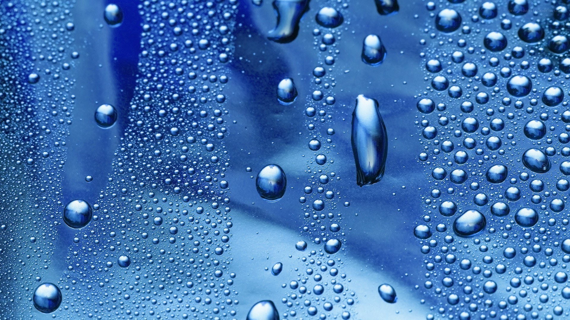 Water droplets on blue surface