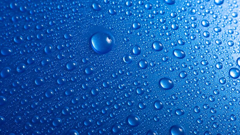 Water droplets on blue surface