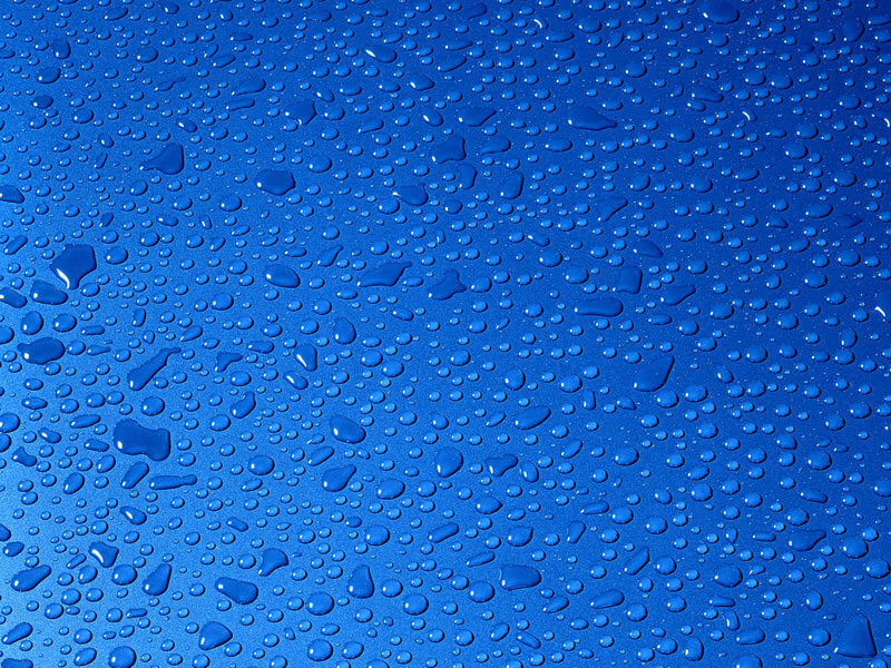 Water droplets on blue surface