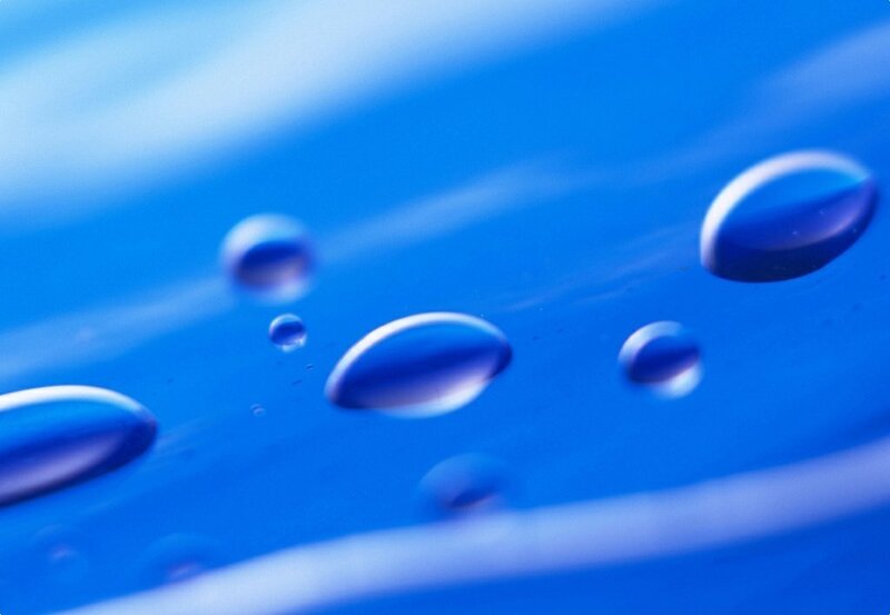 Water droplets on blue surface