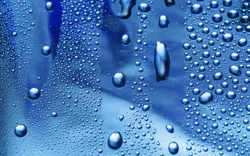 Water droplets on blue surface
