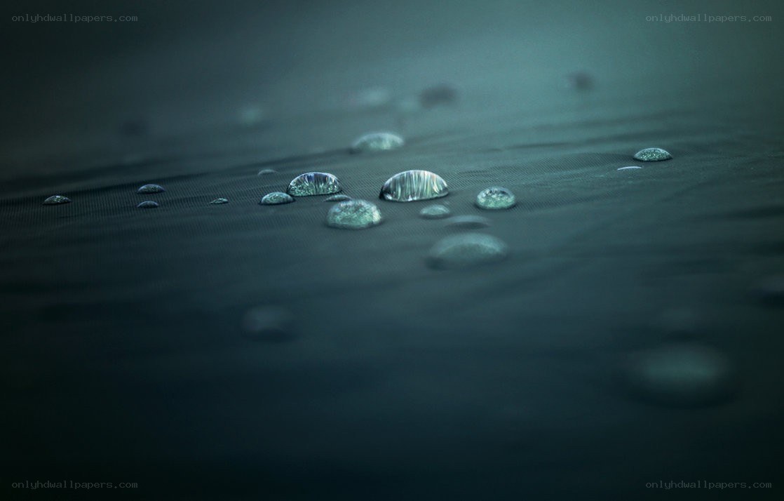Water droplets on dark fabric
