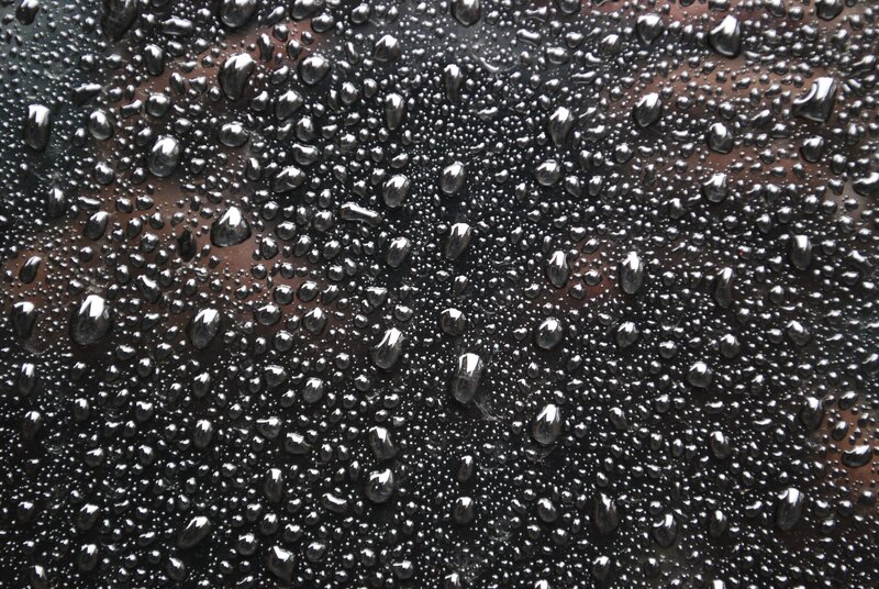 Water droplets on dark surface