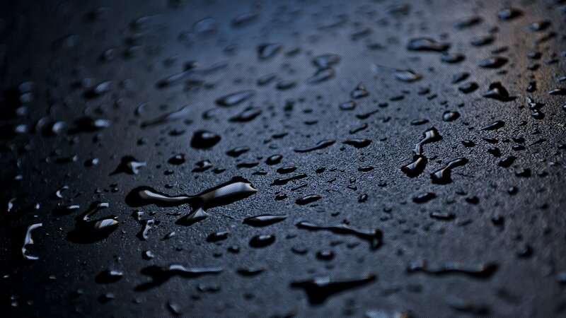 Water droplets on dark surface