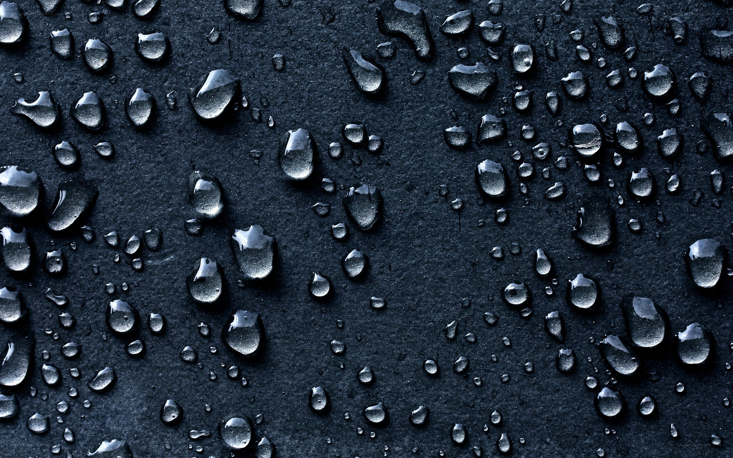 Water droplets on dark surface