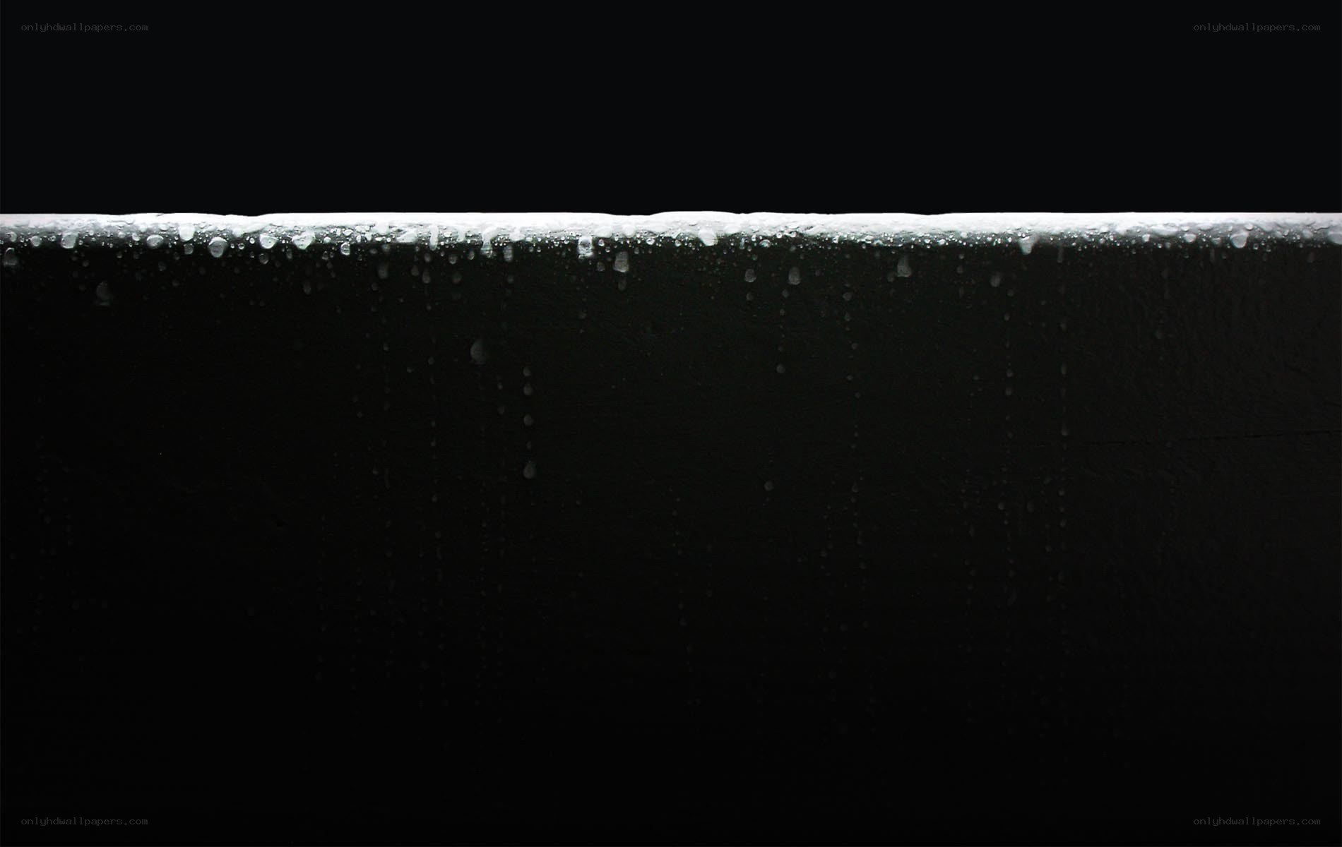 Water droplets on dark surface