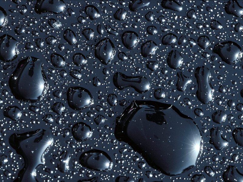 Water droplets on dark surface
