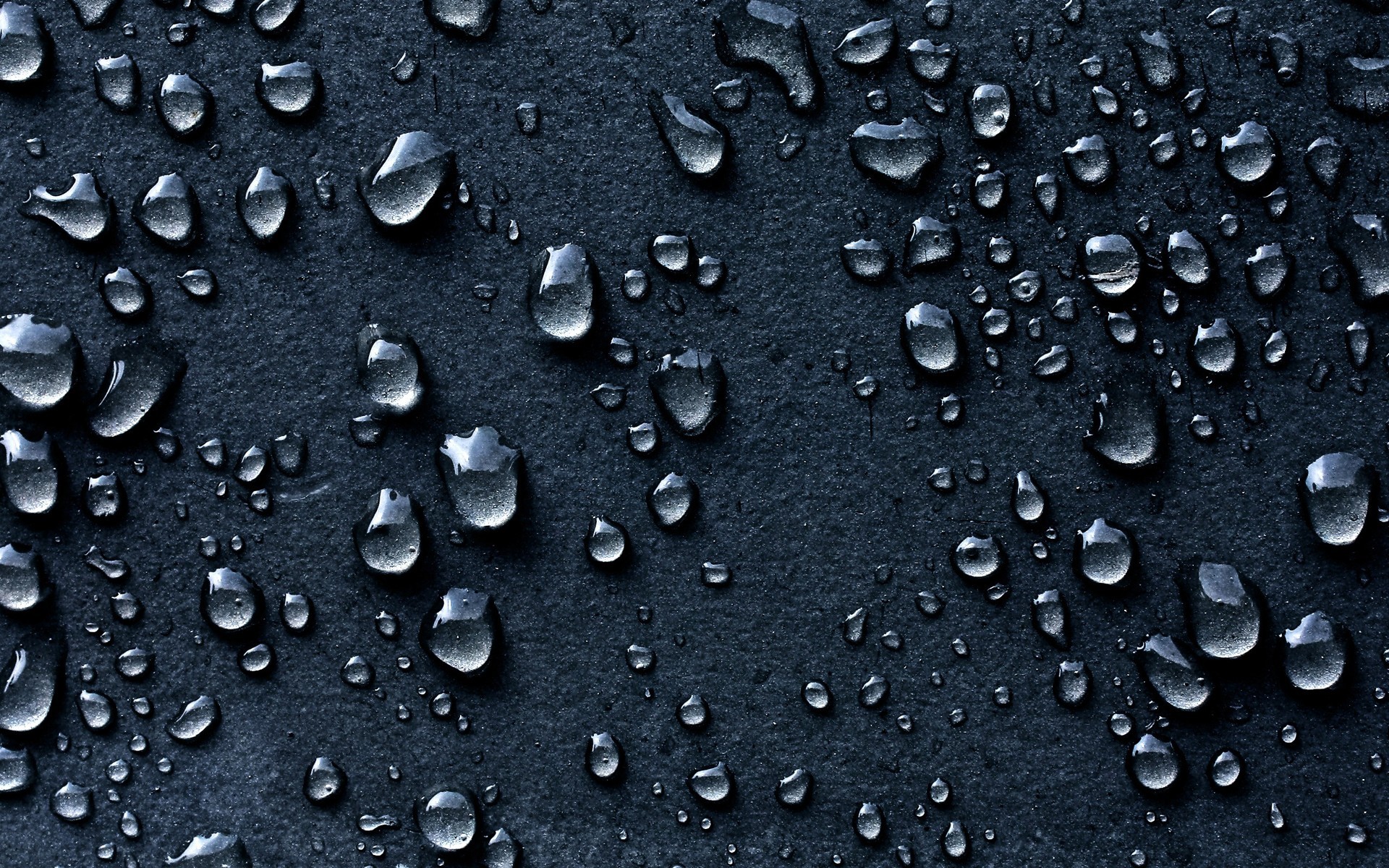 Water droplets on dark surface