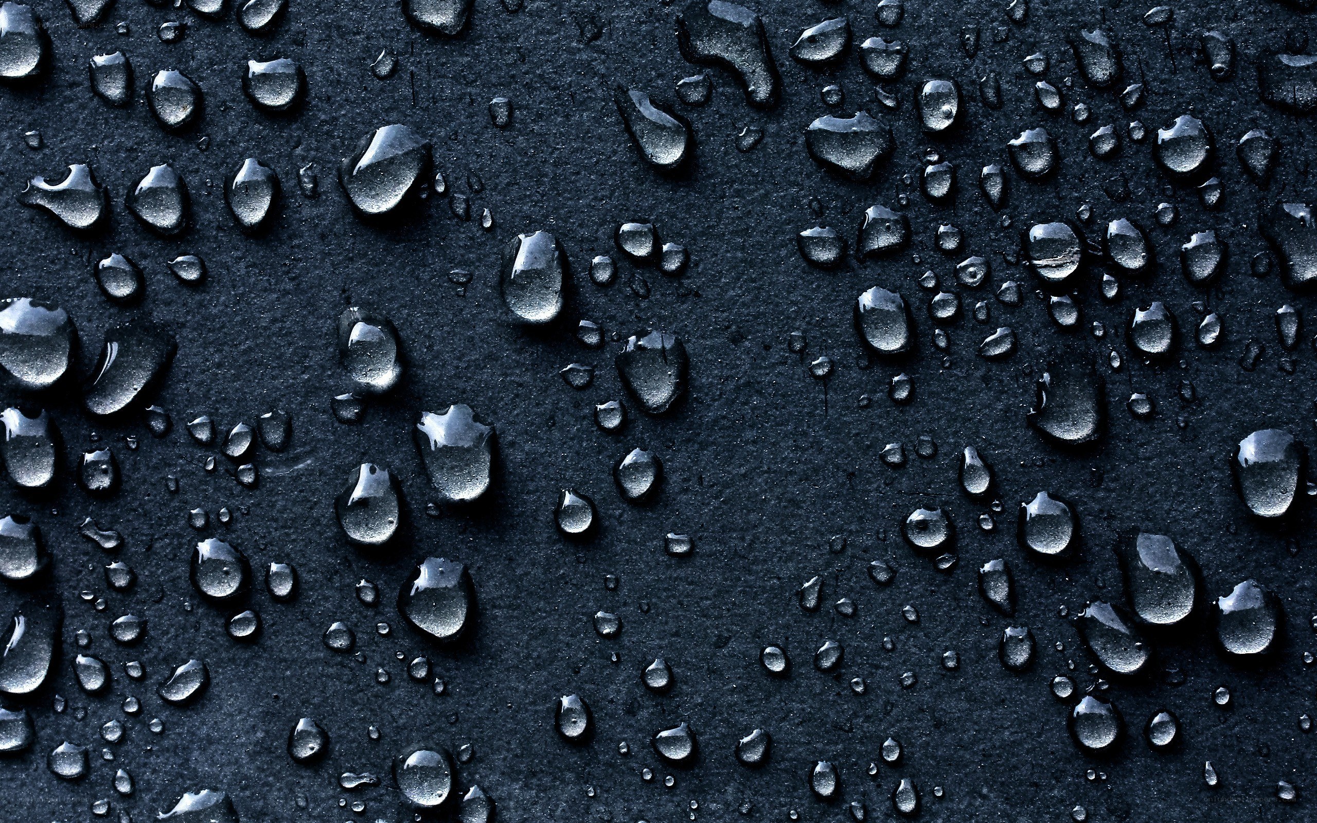 Water droplets on dark surface