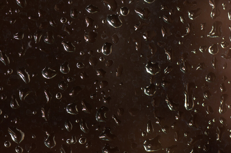 Water droplets on dark surface