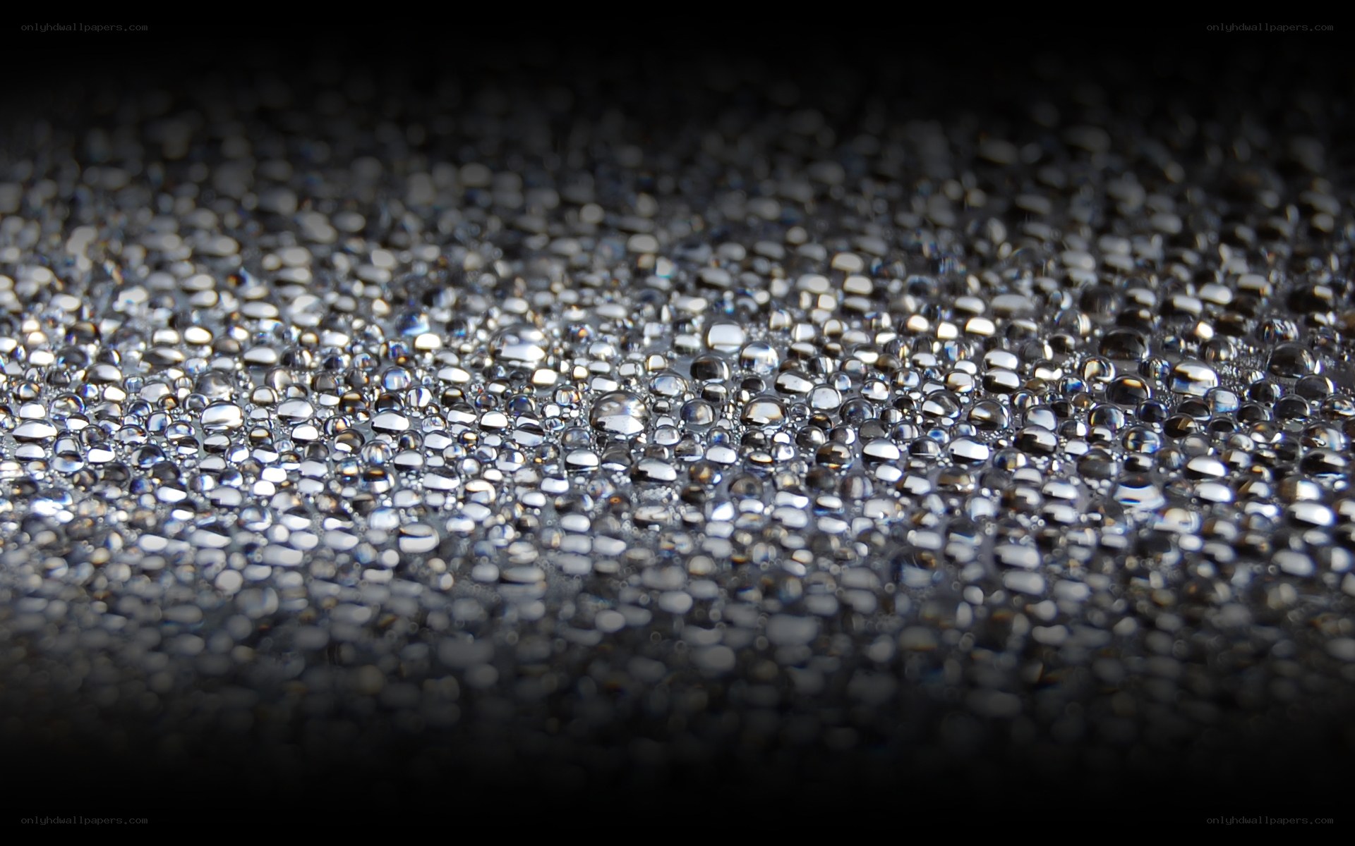 Water droplets on dark surface