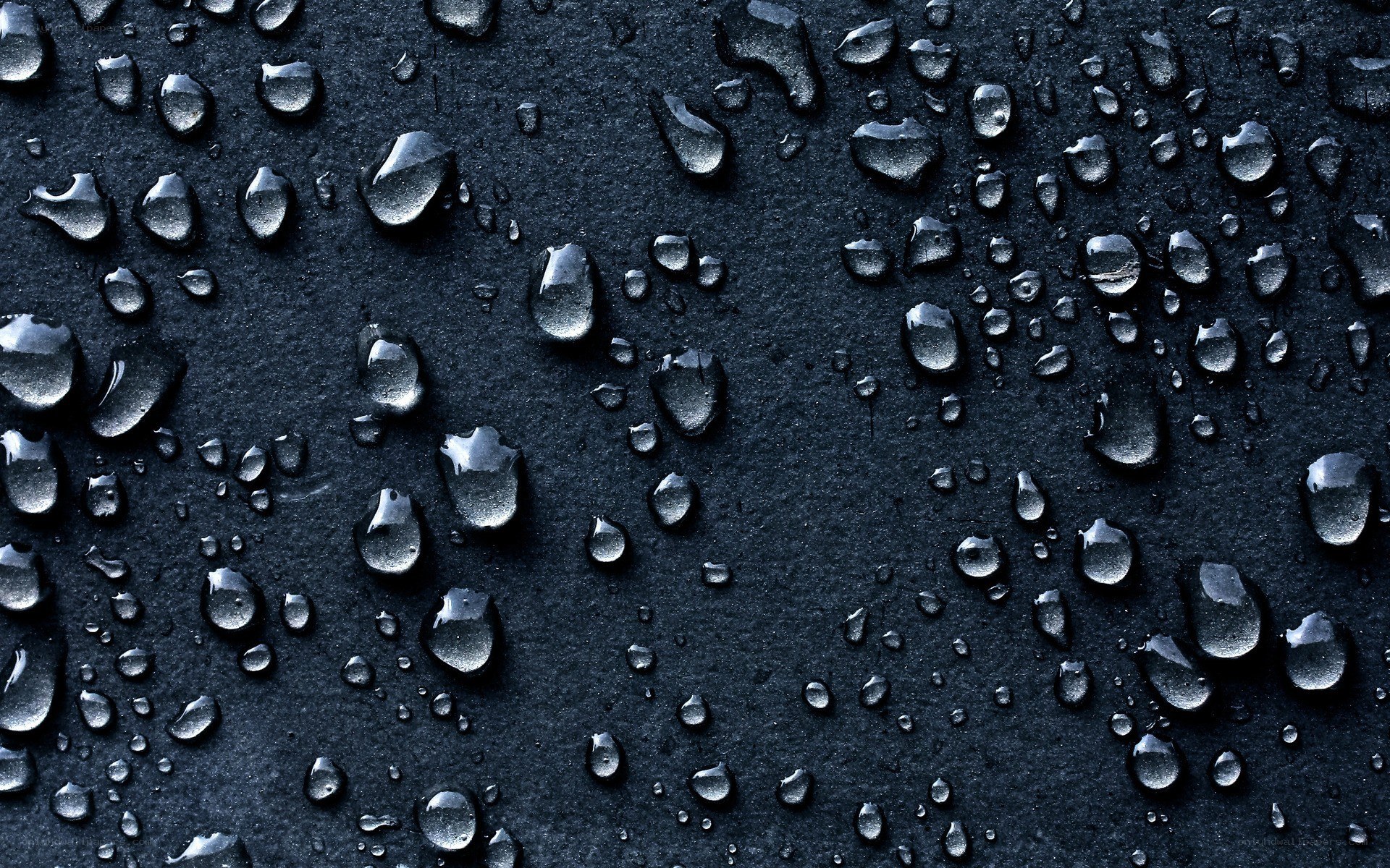 Water droplets on dark surface